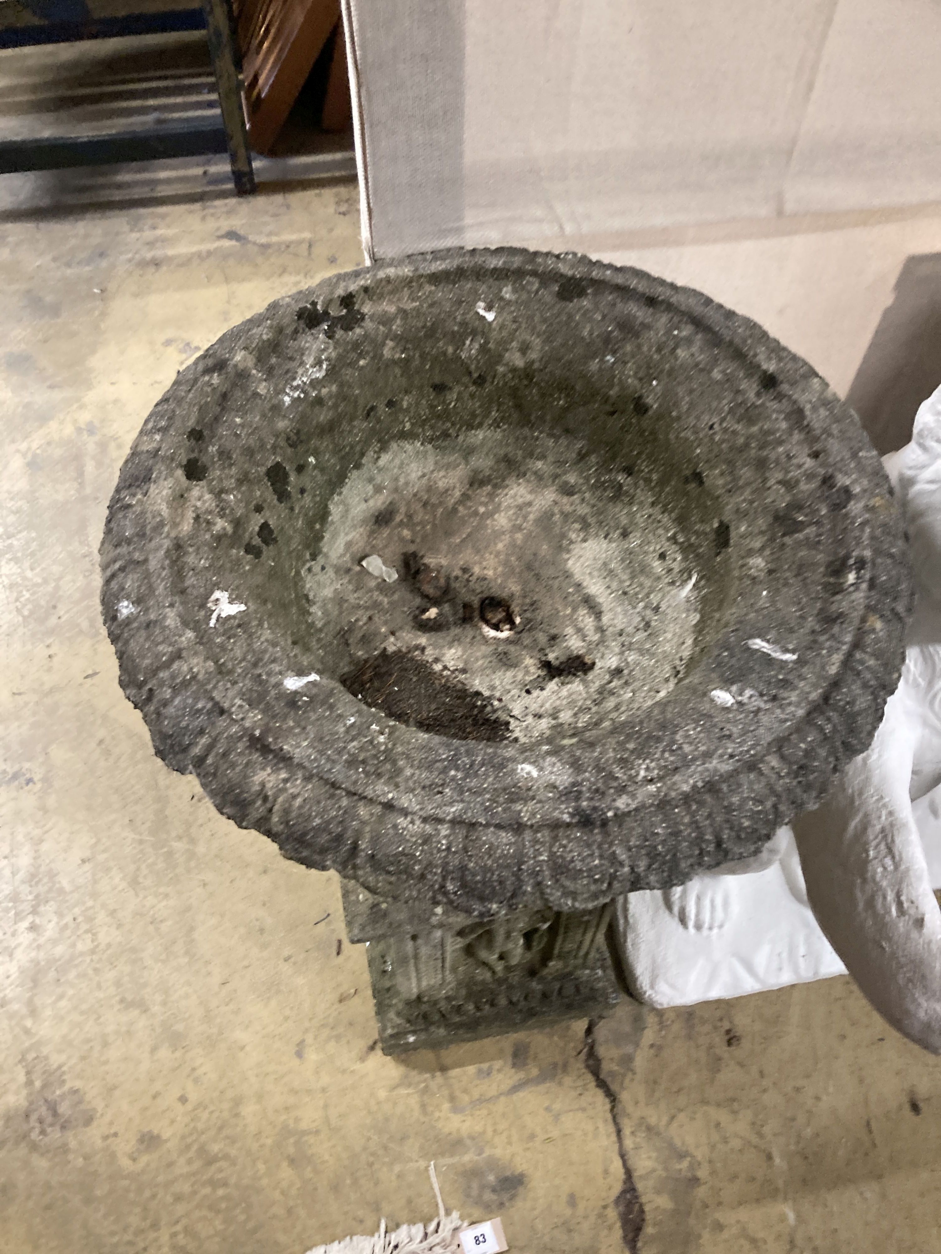 A reconstituted stone campana garden urn on pedestal, diameter 54cm, height 92cm